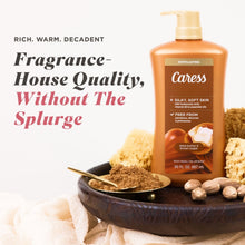 Brown body wash bottle with gold pump, Caress label, and exfoliating panel