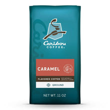 Ground coffee bag with Caribou Coffee logo and caramel flavor label