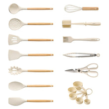 Cooking utensil set with white silicone heads and light wood handles, assorted tools