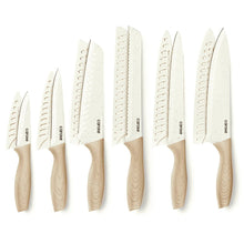 White ceramic kitchen knives with blade guards and cream wooden handles, set