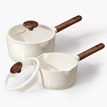 White ceramic nonstick saucepan with wooden-style handle and vented lid