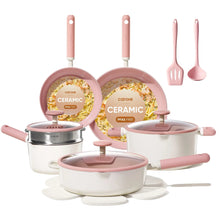 Pink ceramic nonstick cookware set with matching lids, steamer, and utensils