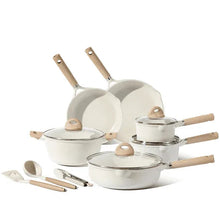 White nonstick pots and pans set with glass lids and wood handles