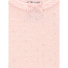 Light pink baby bodysuit with textured knit pattern and bow-tie neckline
