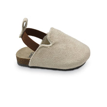 Tan suede infant slip-on clogs, side view, with elastic entry strap