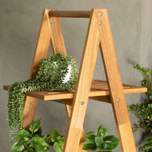 Three-tier outdoor wood plant stand with slatted shelves and A-frame legs