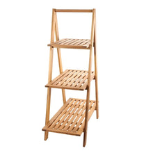 Three-tier outdoor wood plant stand with three slatted platforms and side supports