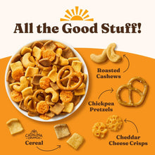 Assorted snack mix in a bowl with pretzel, cereal, and cashew pieces