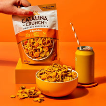 Catalina Crunch cheddar protein snack mix pouch with bowl of crunchy pieces