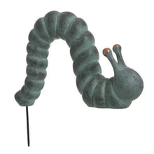 Garden caterpillar statue on white background, curled body with antennae and copper tips