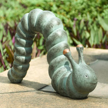 Garden caterpillar statue with curled body and bunny-like head, green stone finish