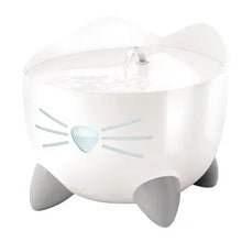 White cat drinking fountain with light-blue heart cat-face emblem and water pump nozzle