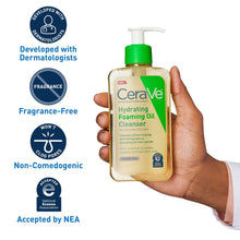 CeraVe hydrating foaming oil cleanser bottle held in hand with white pump and green cap