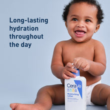 Baby moisturizing lotion pump bottle held by a smiling toddler