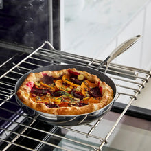 Ceramic nonstick skillet with crust pizza on oven rack