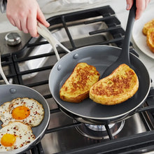 Ceramic nonstick skillet with golden toast slices on stovetop
