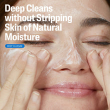 Facial cleanser being applied with hands to closed eyes, skin cleansing