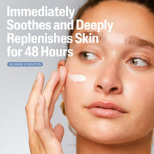 Face cream being applied to cheek with fingertips; white moisturizer smear visible
