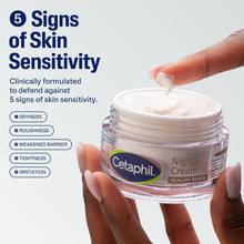 Hands holding clear night cream jar with white cream inside