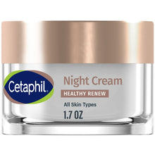 Night cream jar with bronze-toned lid and clear glass base