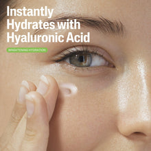 Eye area with hyaluronic acid gel being applied from a tube