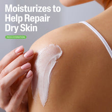 Cetaphil moisturizing cream on skin with white cream swatch, hand applying