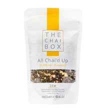 All Chai'd Up chai tea pouch with yellow label and visible loose tea