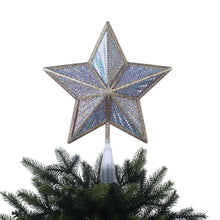 Iridescent LED star tree topper with glowing bulbs over green branches