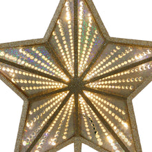Close-up of champagne-gold LED star topper with bright ring lights