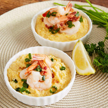 Shrimp and cornmeal cups with parsley and lemon wedges on cloth