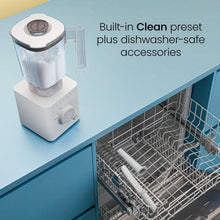 Ice-crushing blender on counter next to a dishwasher rack with removable parts