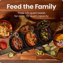 Triple slow cooker with three filled stoneware crocks and serving utensils