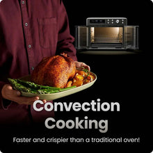 Convection cooking air fryer toaster oven with chef holding a roast and vegetables on a tray
