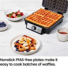 4-slice Belgian waffle maker with golden waffle squares on plates and bowls