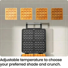4-slice Belgian waffle maker with open plates and four golden waffles