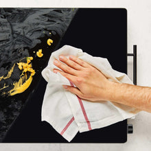 Electric warming tray with wipe-clean black surface and control knobs