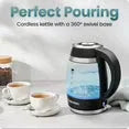 Black cordless electric kettle with blue water indicator and two cups