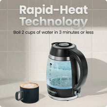 Cordless electric kettle with water level window, black kettle on countertop.