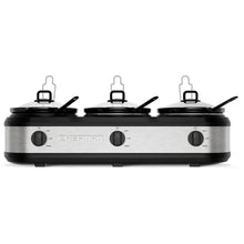 Triple slow cooker base with three black lid handles and stainless steel housing