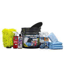 Car wash detail kit with microfiber mitts, bottles, wheel brush, and scrubbing pads
