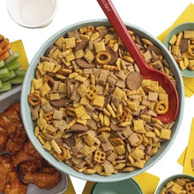 Snack mix in a bowl with crackers and pretzel rings.