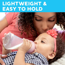 Lightweight baby bottle with sipper nipple, being held during feeding