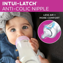 Baby drinking from a feeding bottle with anti-colic nipple