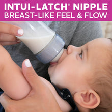 Baby drinking from a clear baby bottle with anti-colic Intu-latch nipple and cap