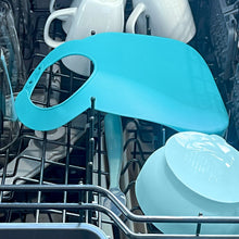 Teal silicone feeding bib in dishwasher rack for cleaning