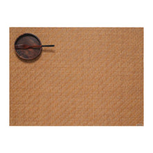 Woven brown placemat with fine textured pattern