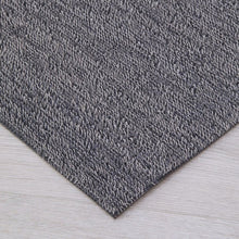 Dark gray shag mat runner corner with textured surface and backing, 2 ft x 6 ft