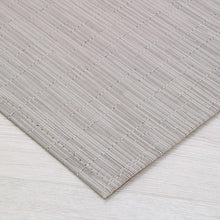 Chilewich woven willow rug corner, light gray flatweave texture