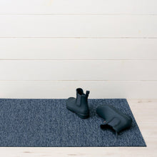 Navy shag indoor/outdoor mat with short textured pile and grippy surface