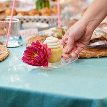 Clear plastic 7 in dessert plate with cupcake and flower garnish, ridged rim